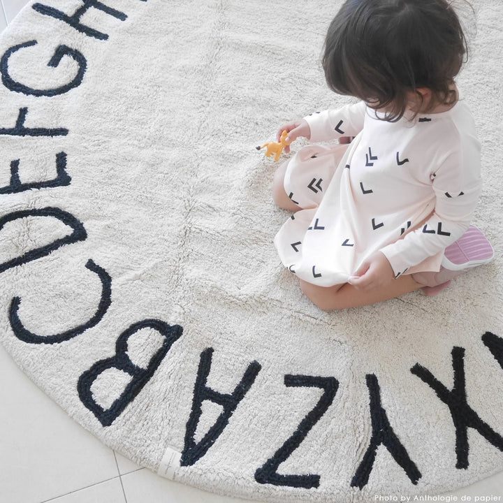 Round ABC Rug in Natural & Black design by Lorena Canals