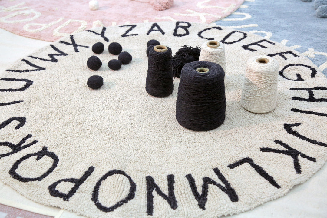 Round ABC Rug in Natural & Black design by Lorena Canals